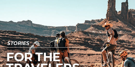 people on bicycles in desert area