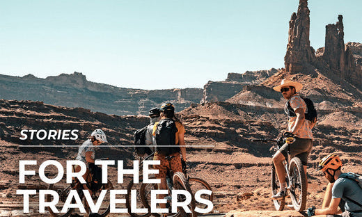 people on bicycles in desert area