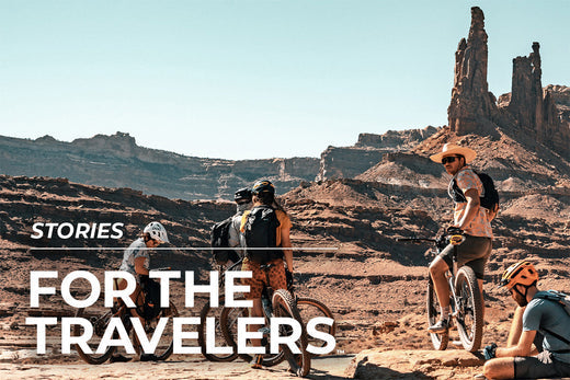 people on bicycles in desert area