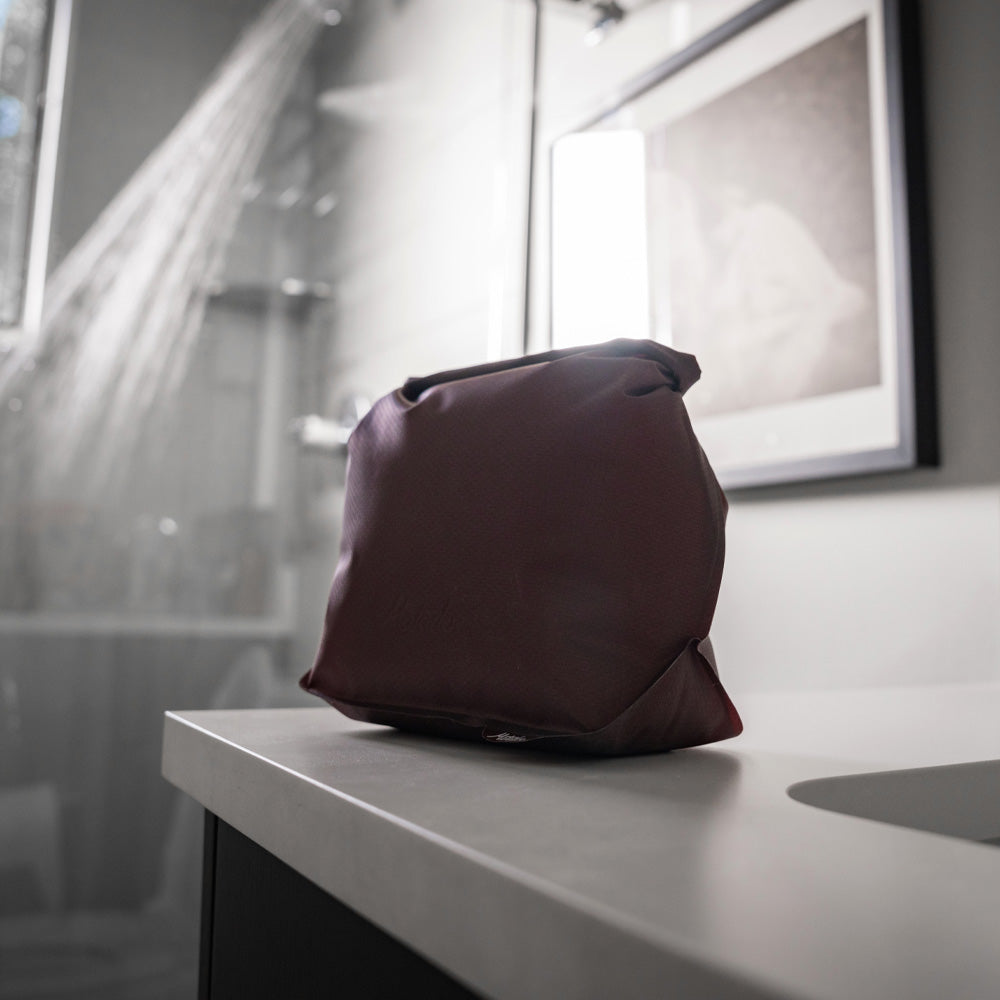 garnet toiletry case on corner of bathroom counter