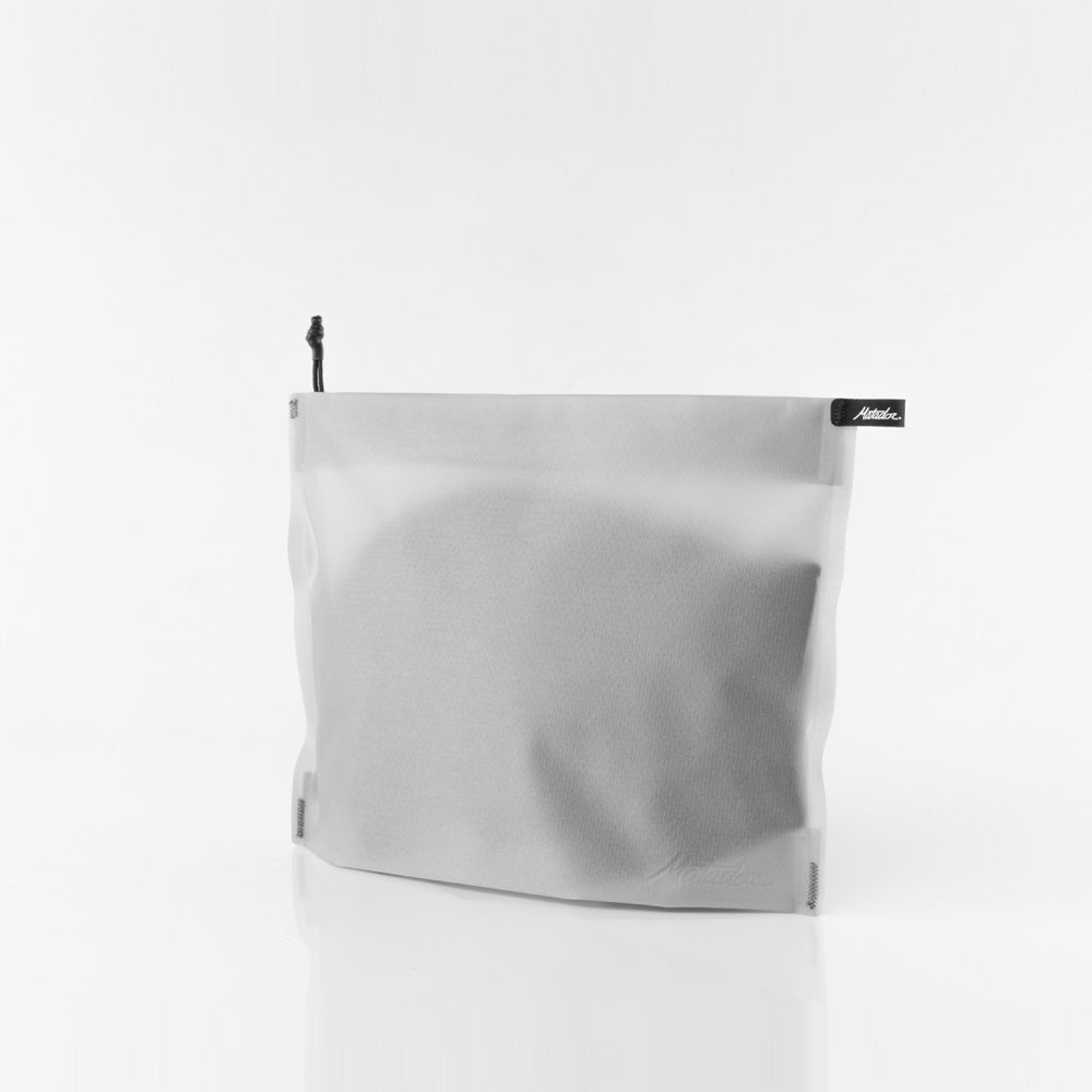 white zipper toiletry case on white background