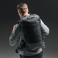 Back view of man wearing GlobeRider 45 on dark gray background