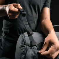 Man attaching the detachable hip belt to the SEG28