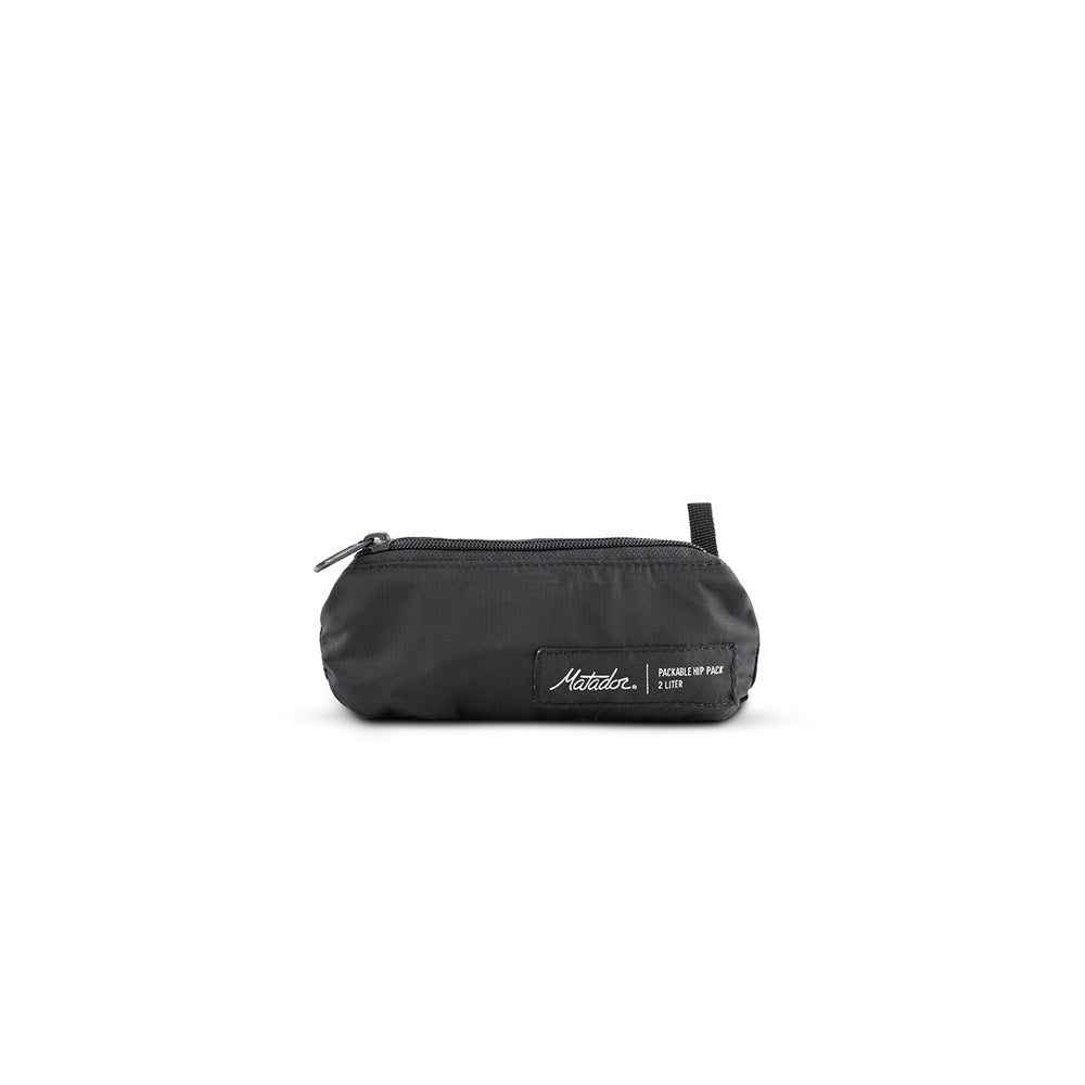 packed up black sling bag on white background