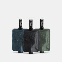 Toiletry bottle 3-pack multi1 charcoal slate and sage on light gray background