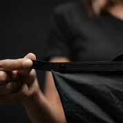 Close up view of hands displaying snap buttons