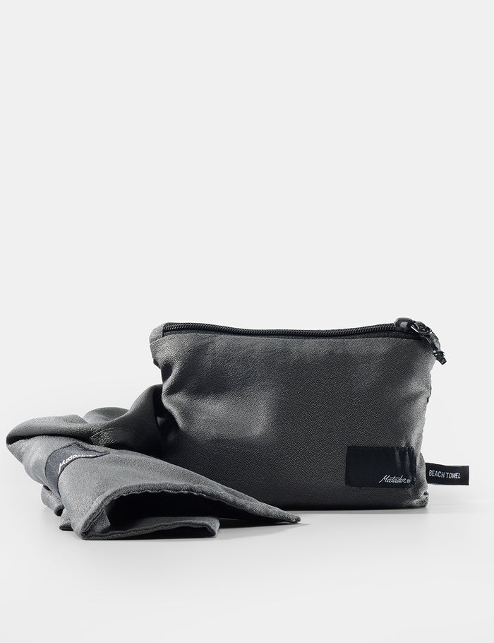 gray pouch with a label on a white background