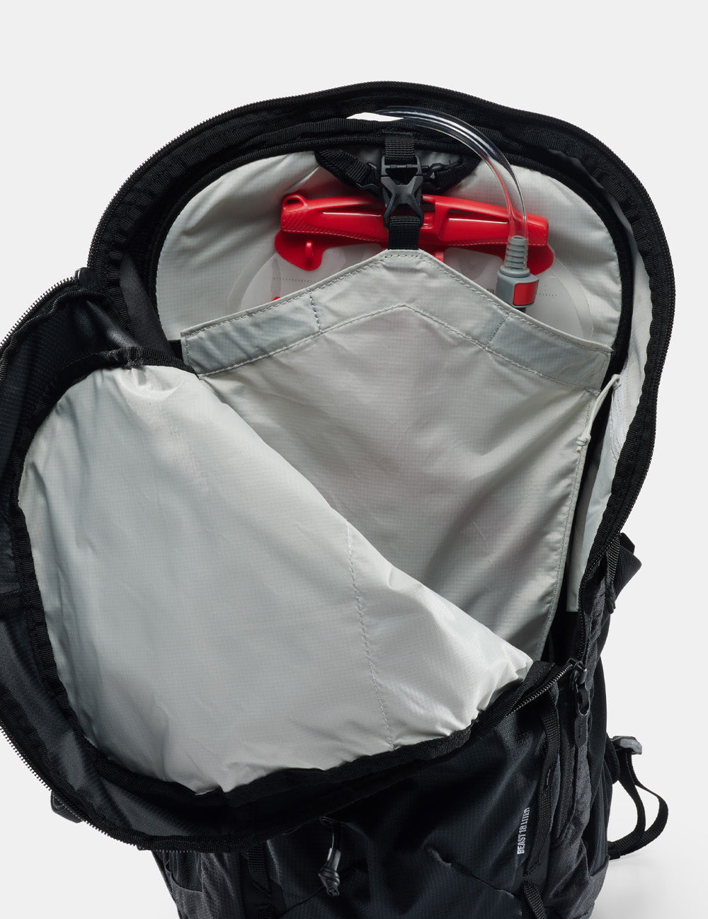black backpack open to show interior
