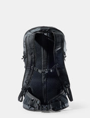 Black backpack with visible branding on a white background