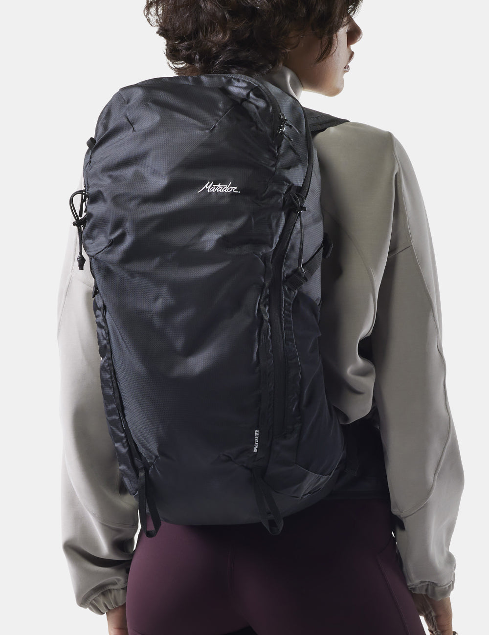 woman wearing black backpack