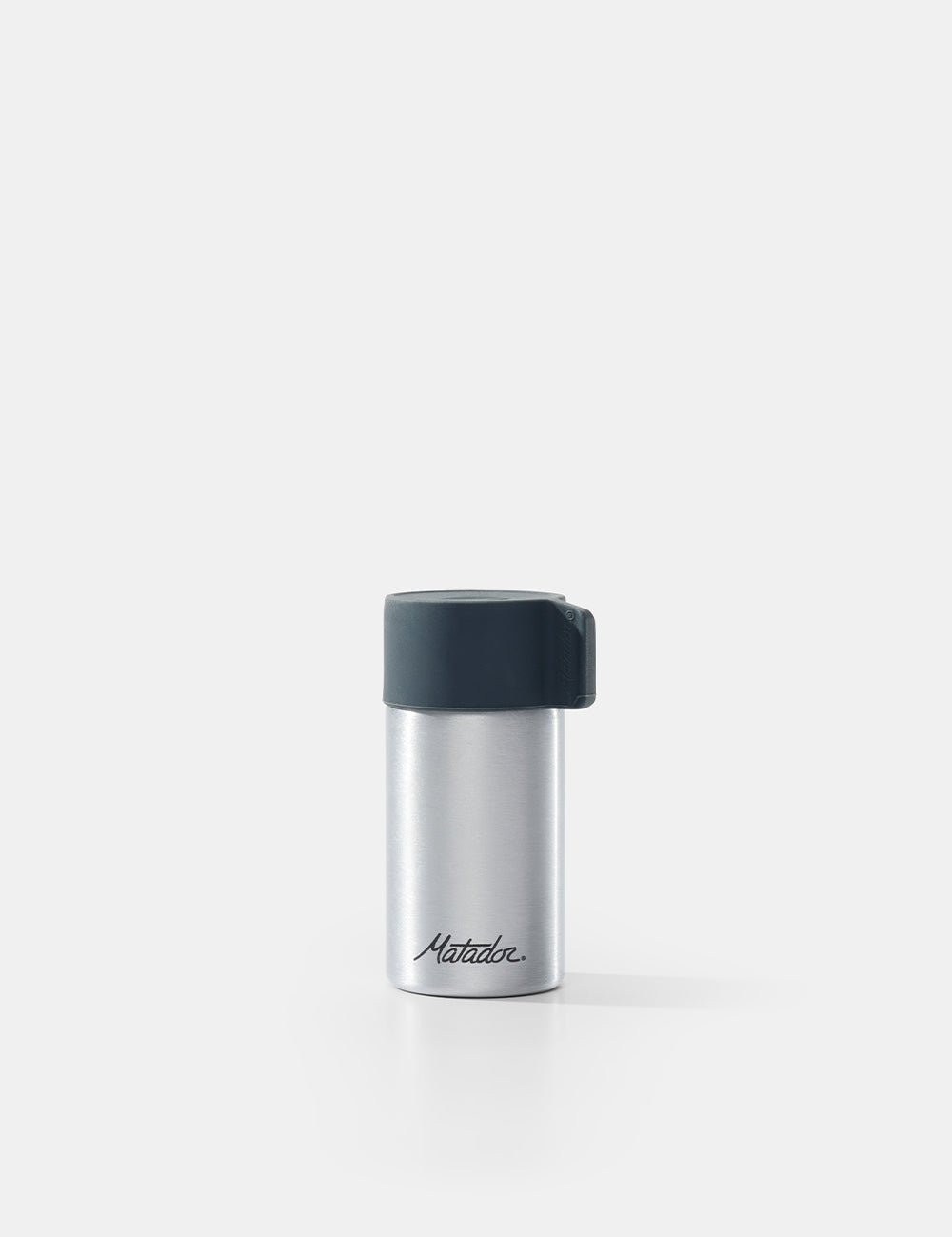 Silver container with black lid on a white background