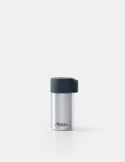 Silver container with black lid on a white background