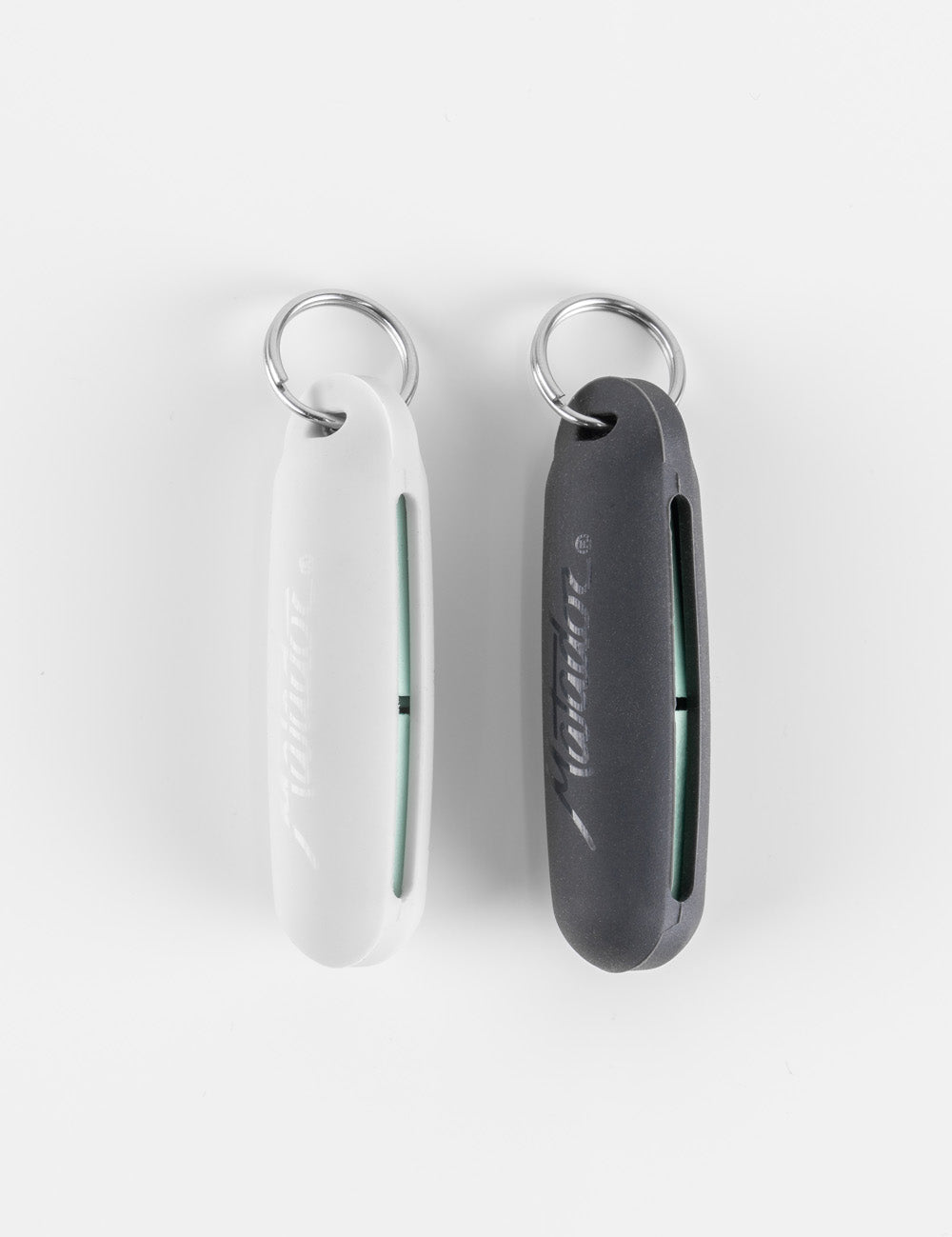 white and black earplug cases on white background with mint earplugs inside