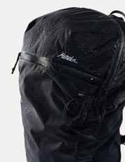 Black backpack with 'matdor' branding on a light gray background