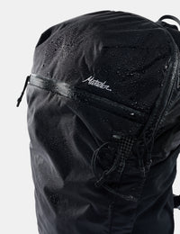 Black backpack with 'matdor' branding on a light gray background