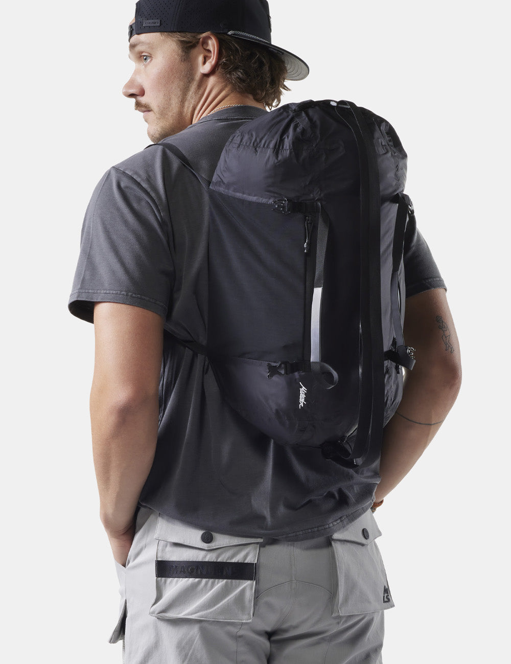 man wearing black duffle on his back