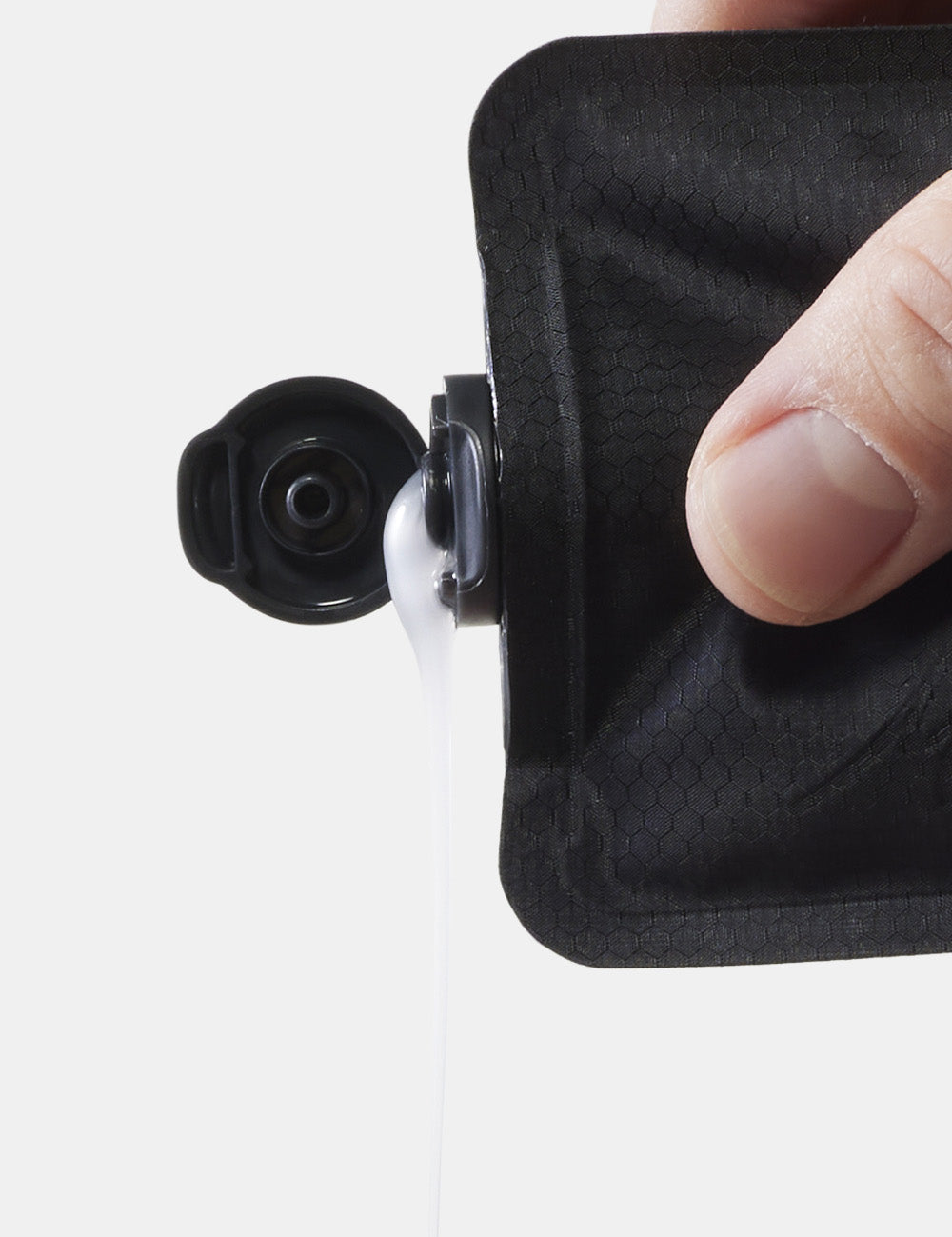 Close up view of toiletry bottle cap, squeezing soap out