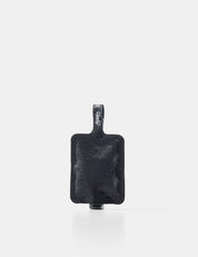 Black toiletry bottle with a strap on a white background