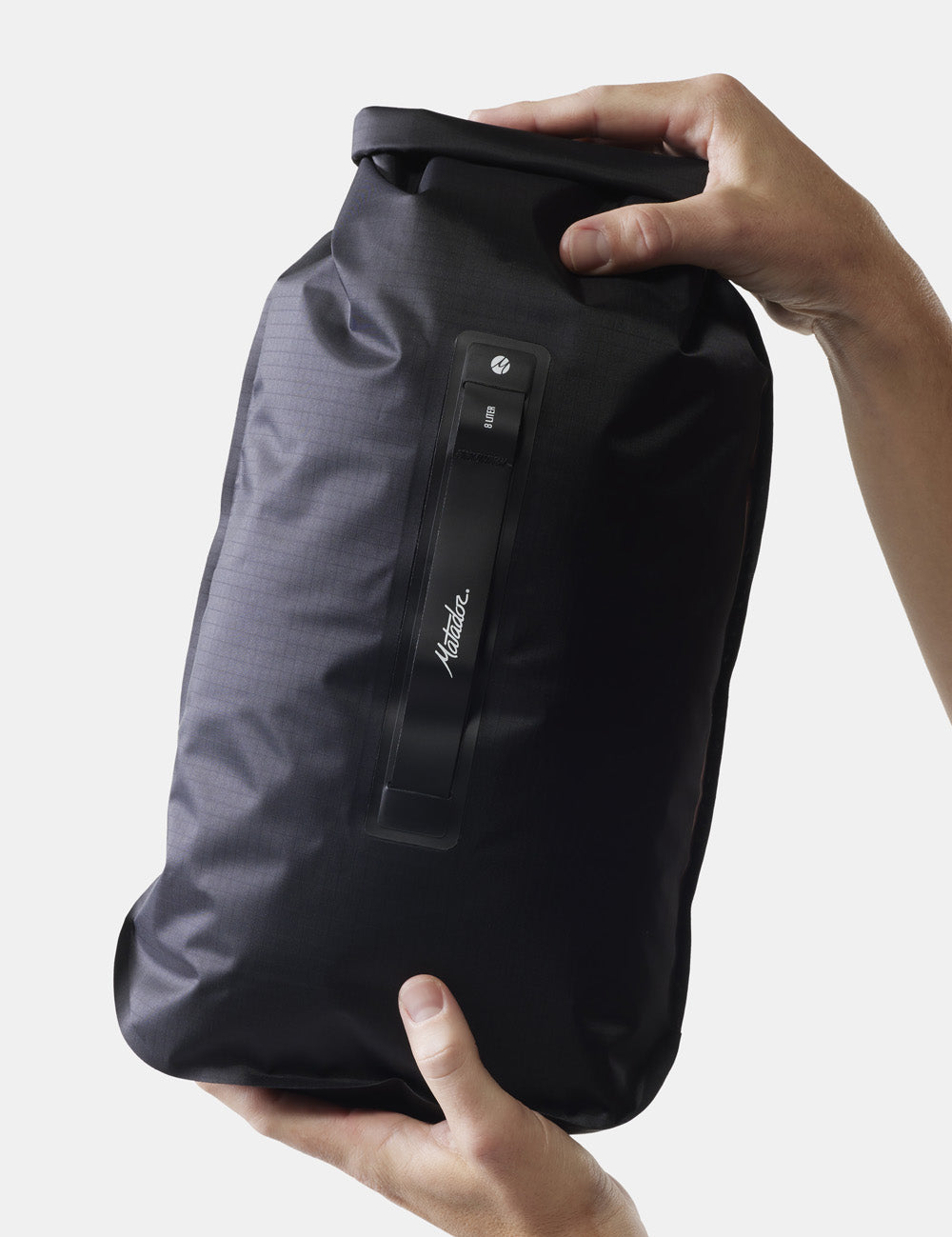 hand holding dry bag