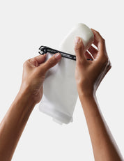 hand placing soap bar in arctic white soap bar case