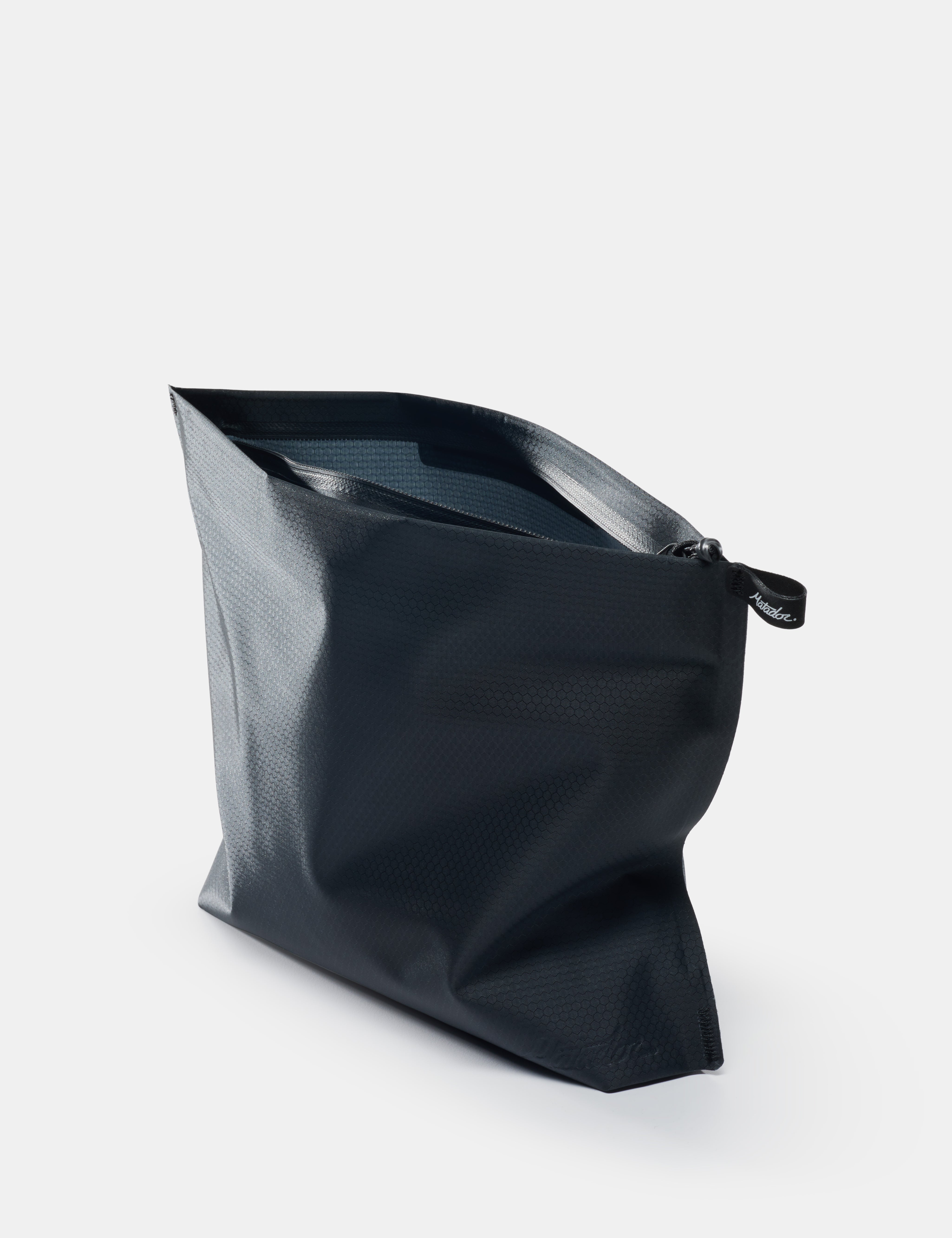 open black toiletry case on white background