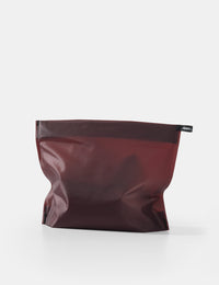 garnet toiletry case on white background