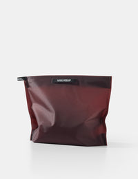 garnet toiletry case on white background