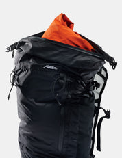 Black backpack with orange interior clothing on a white background