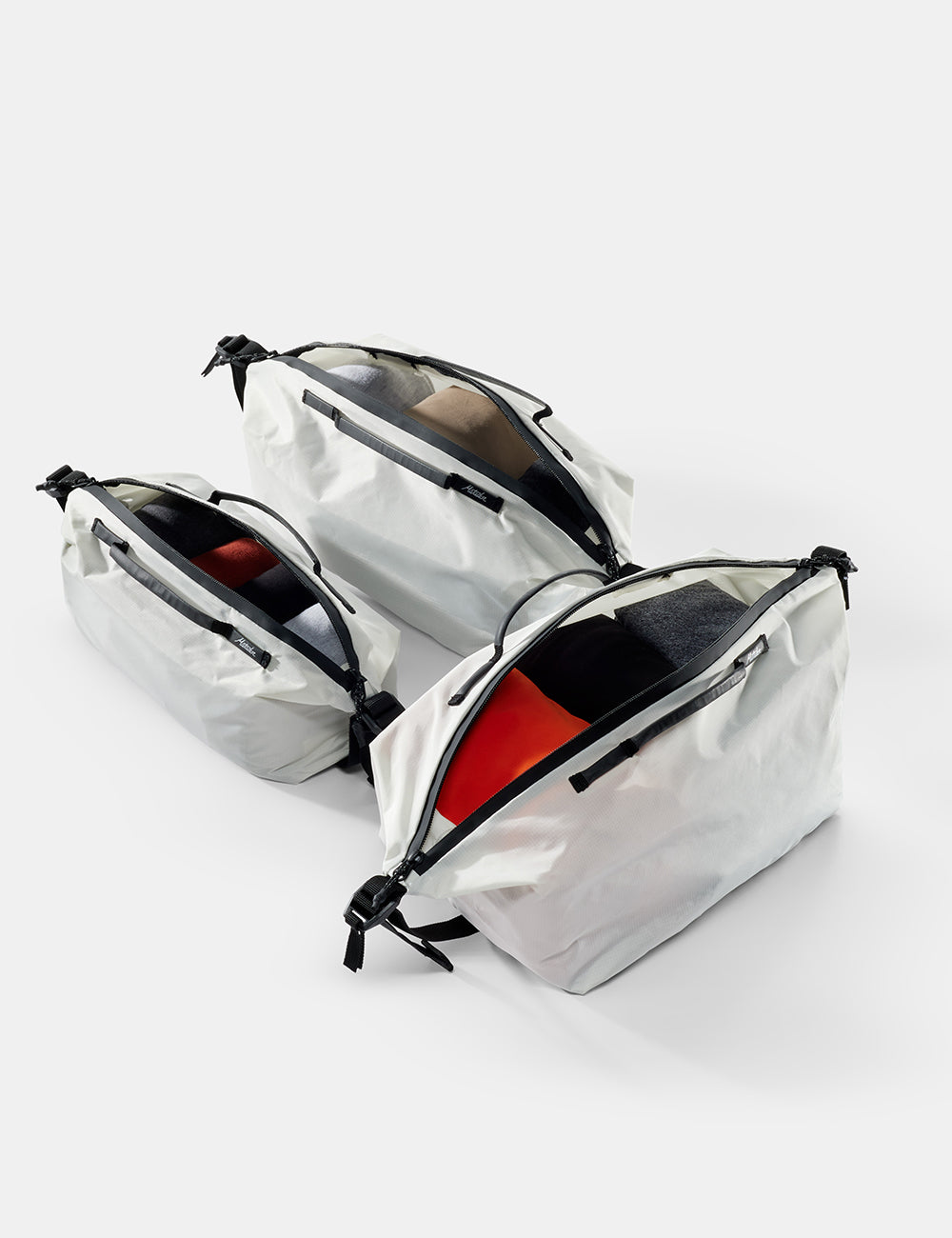 3 white gear cubes on white background open to show contents