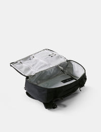 Black backpack with open compartment on a white background
