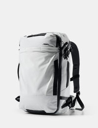 White backpack with black straps on a white background