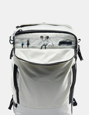 White backpack with black zippers and straps on a white background