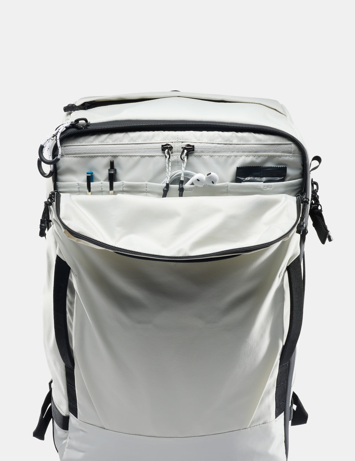 White backpack with black zippers and straps on a white background