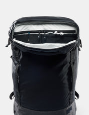 Black backpack with open front compartment on a white background