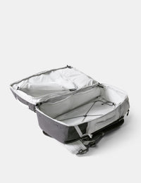Gray backpack with open lid on a white background