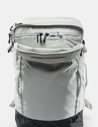 Light gray backpack with multiple zippers on a white background