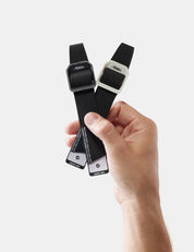 hand holding 2 gear tags on white background