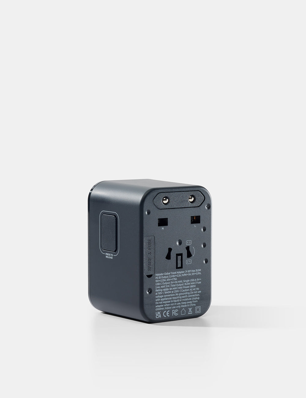 Black travel adapter on a white background