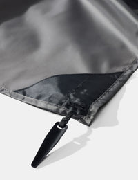 Close-up of pocket blanket corner stake on a white background