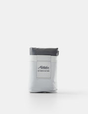 Gray and white pouch with a brand label on a white background