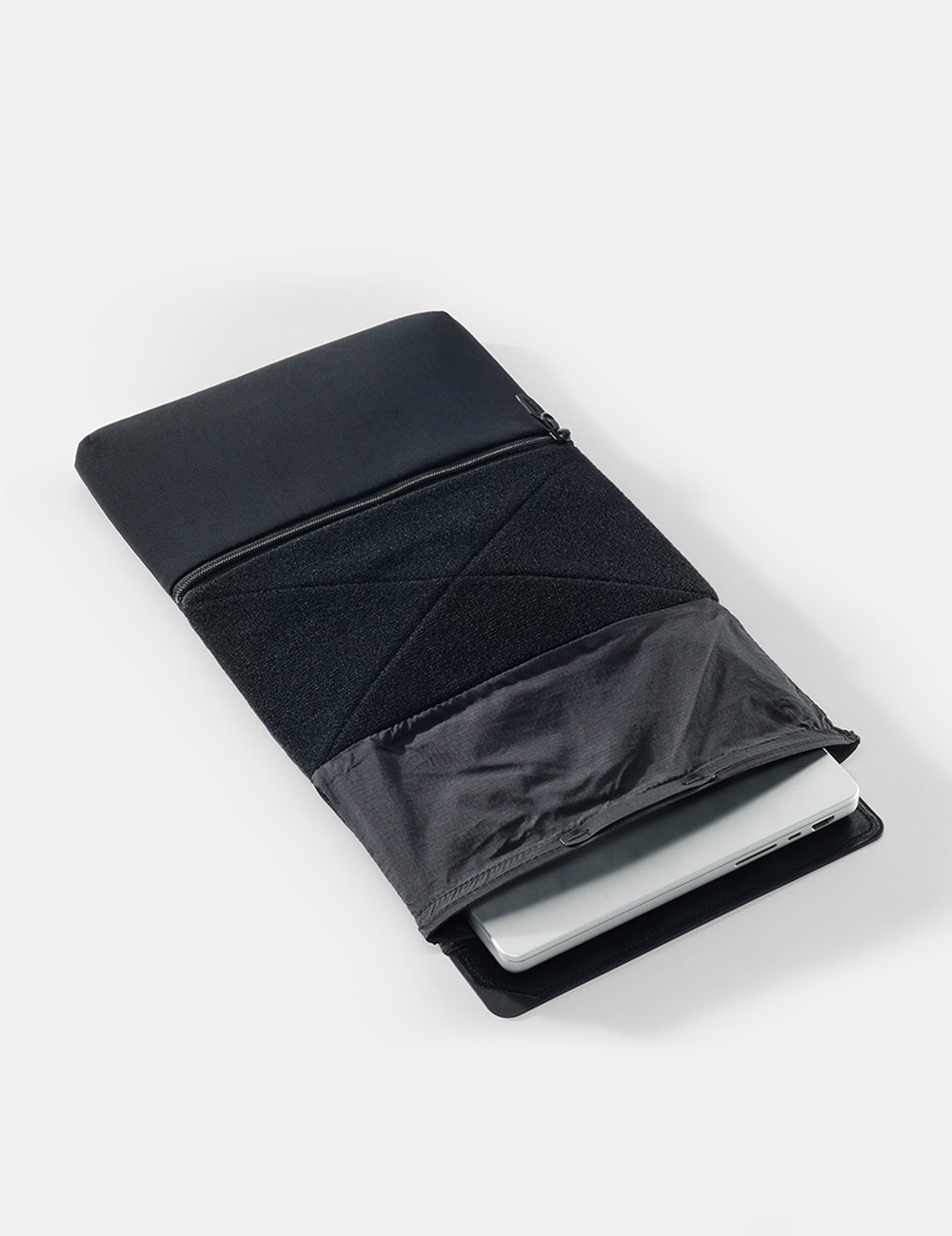 laptop base layer with computer on a white surface