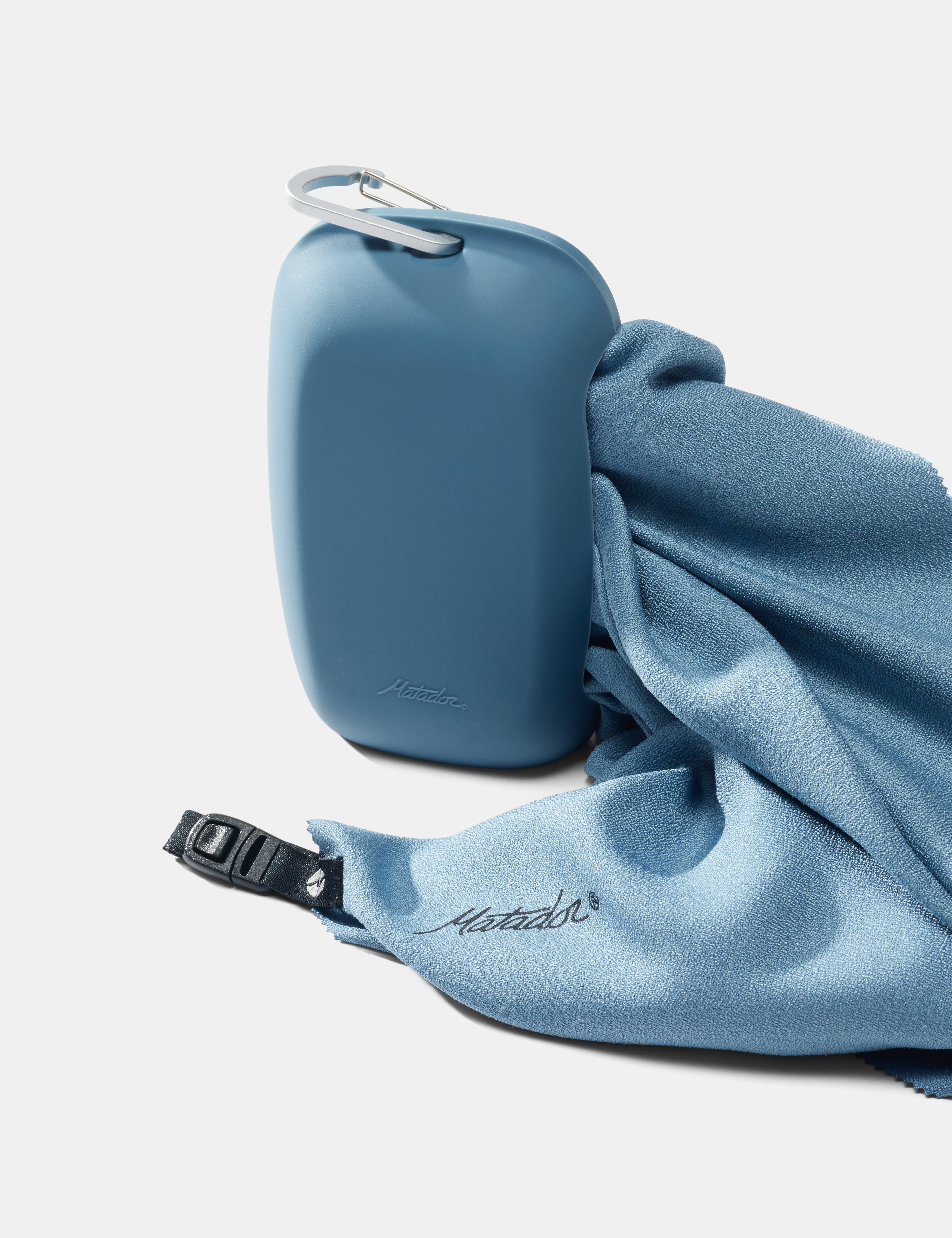 Slate towel coming out of silicone case on a white background