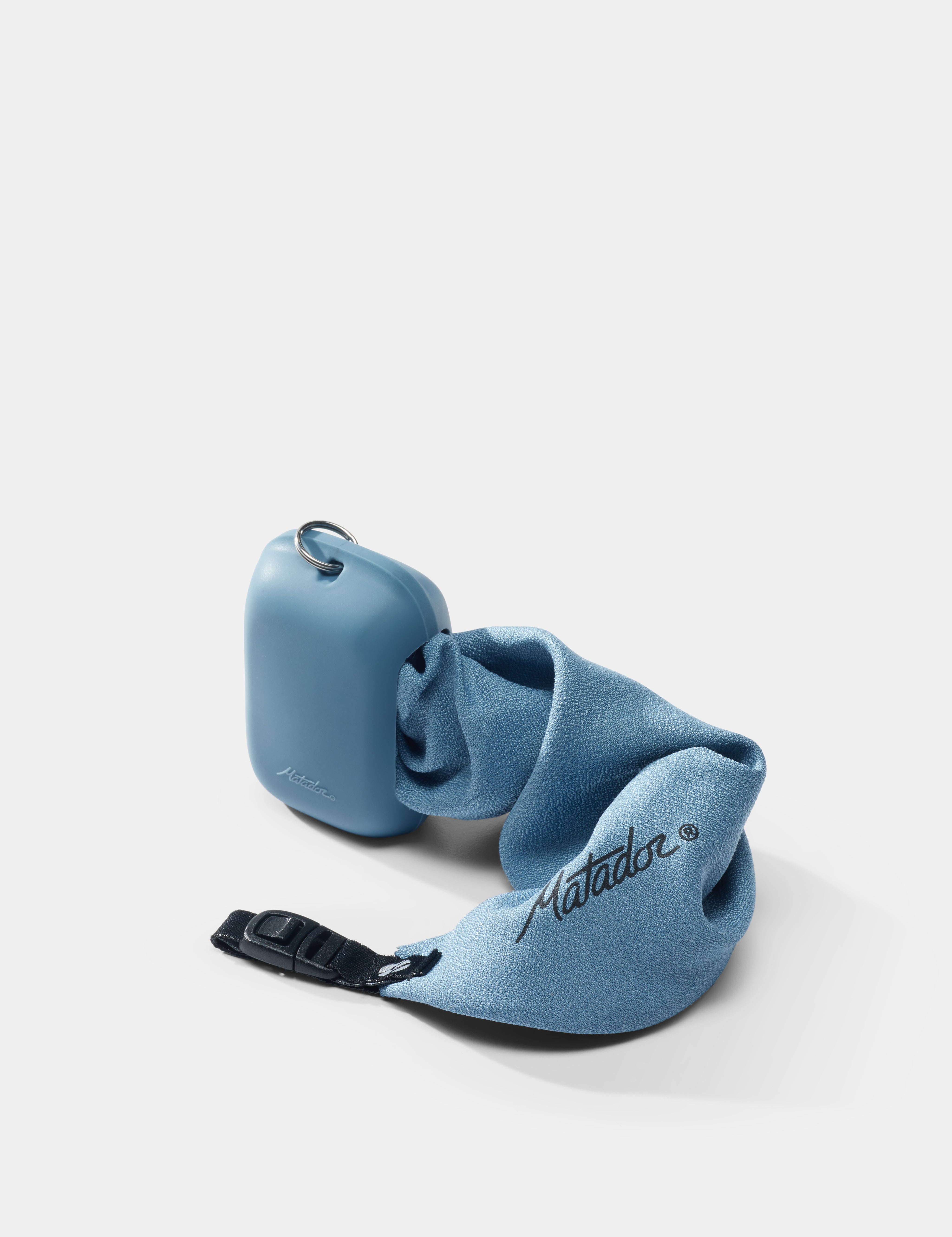 slate towel coming out of silicone case on white background