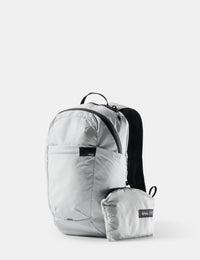 Light gray backpack with a smaller pack attached on a white background
