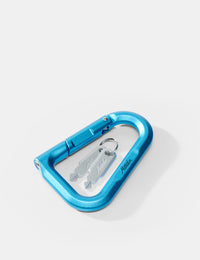 Blue carabiner with keys on a white background