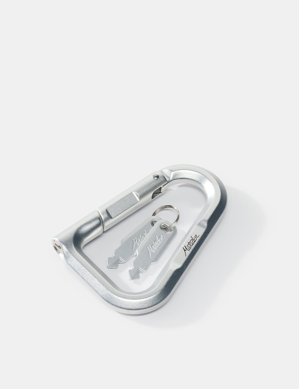 Metallic carabiner with a keychain on a white background