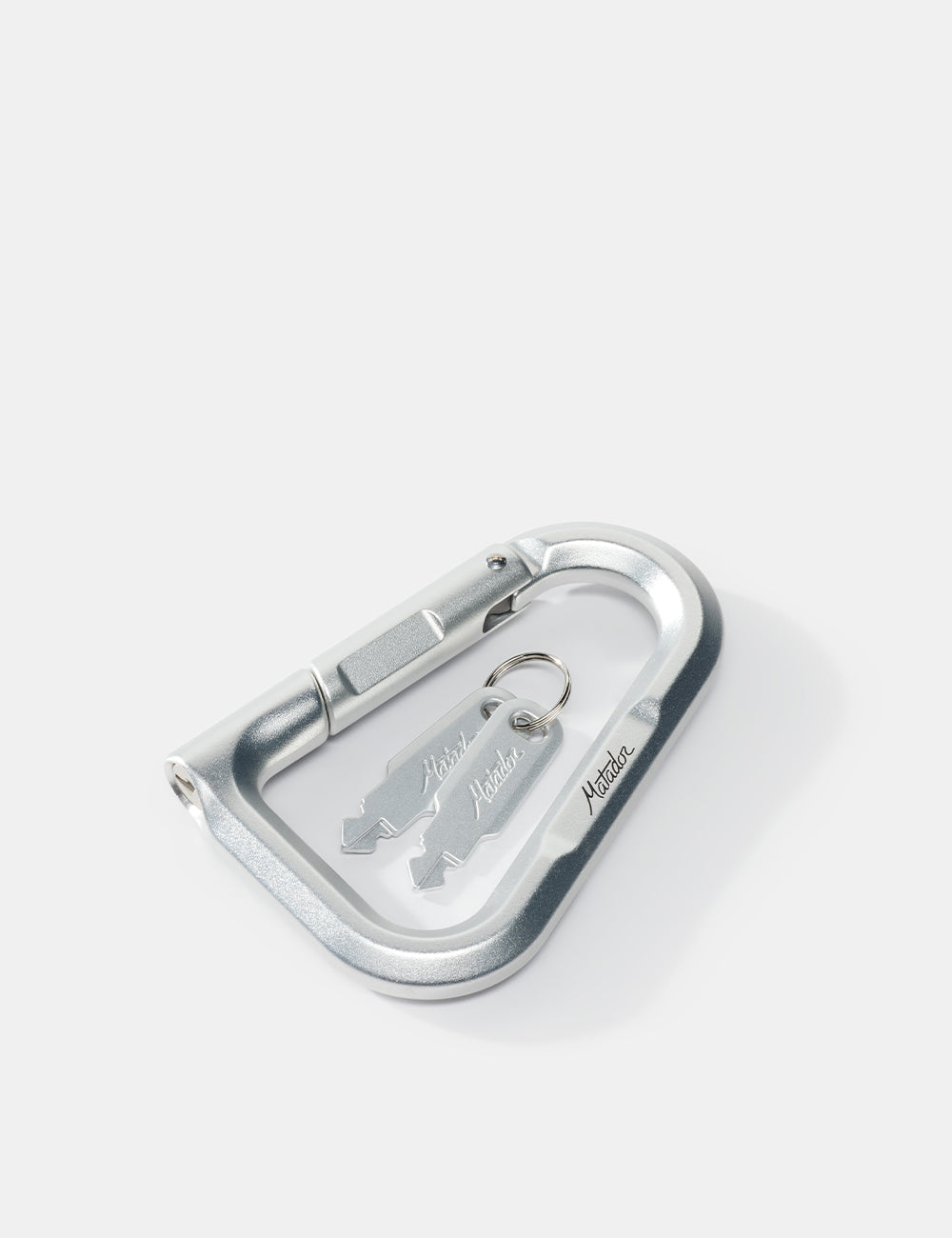 Metallic carabiner with a keychain on a white background