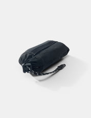 Black folded bag with a strap on a white background