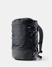 Black backpack with visible branding on a white background