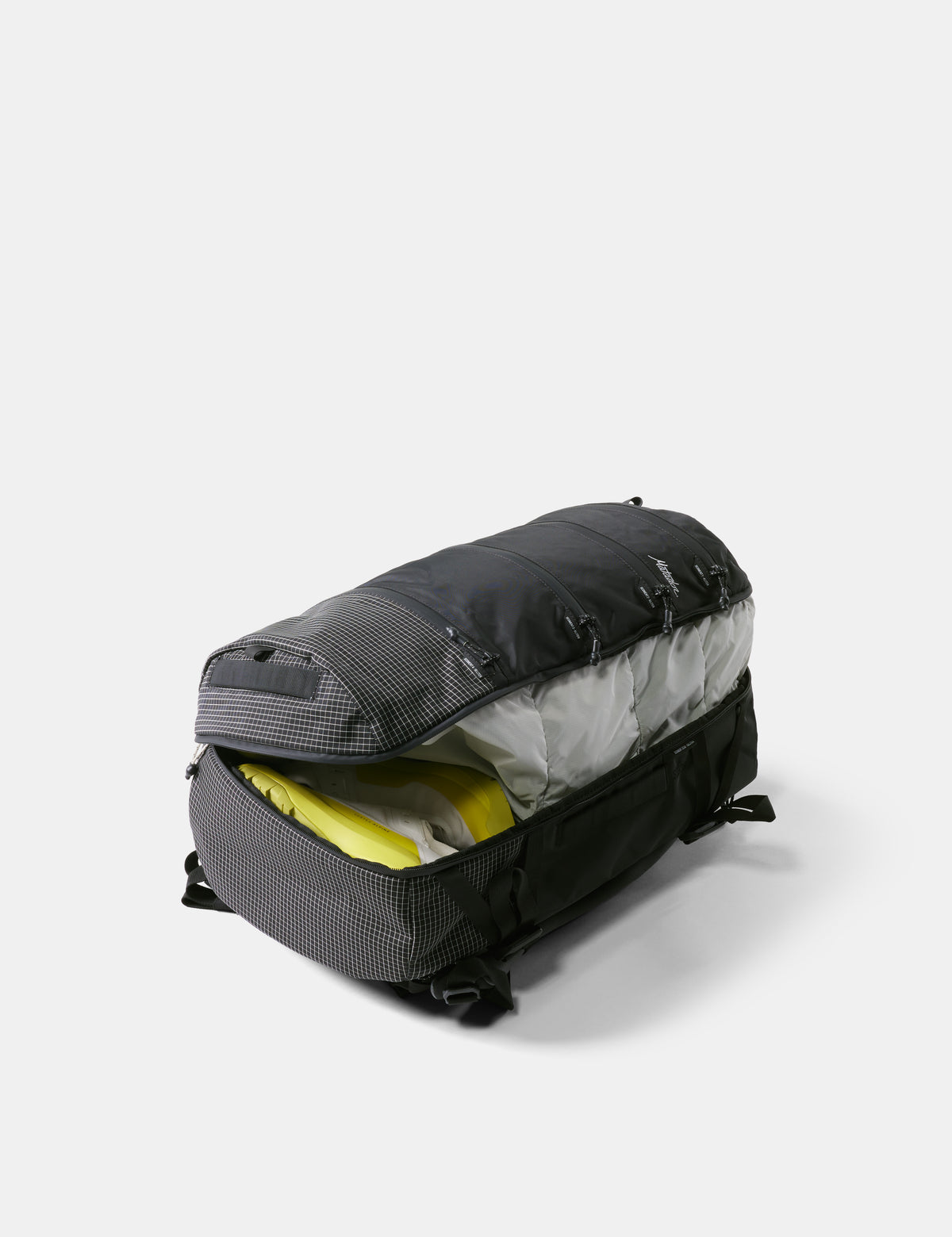 Black duffel bag with open interior on a white background